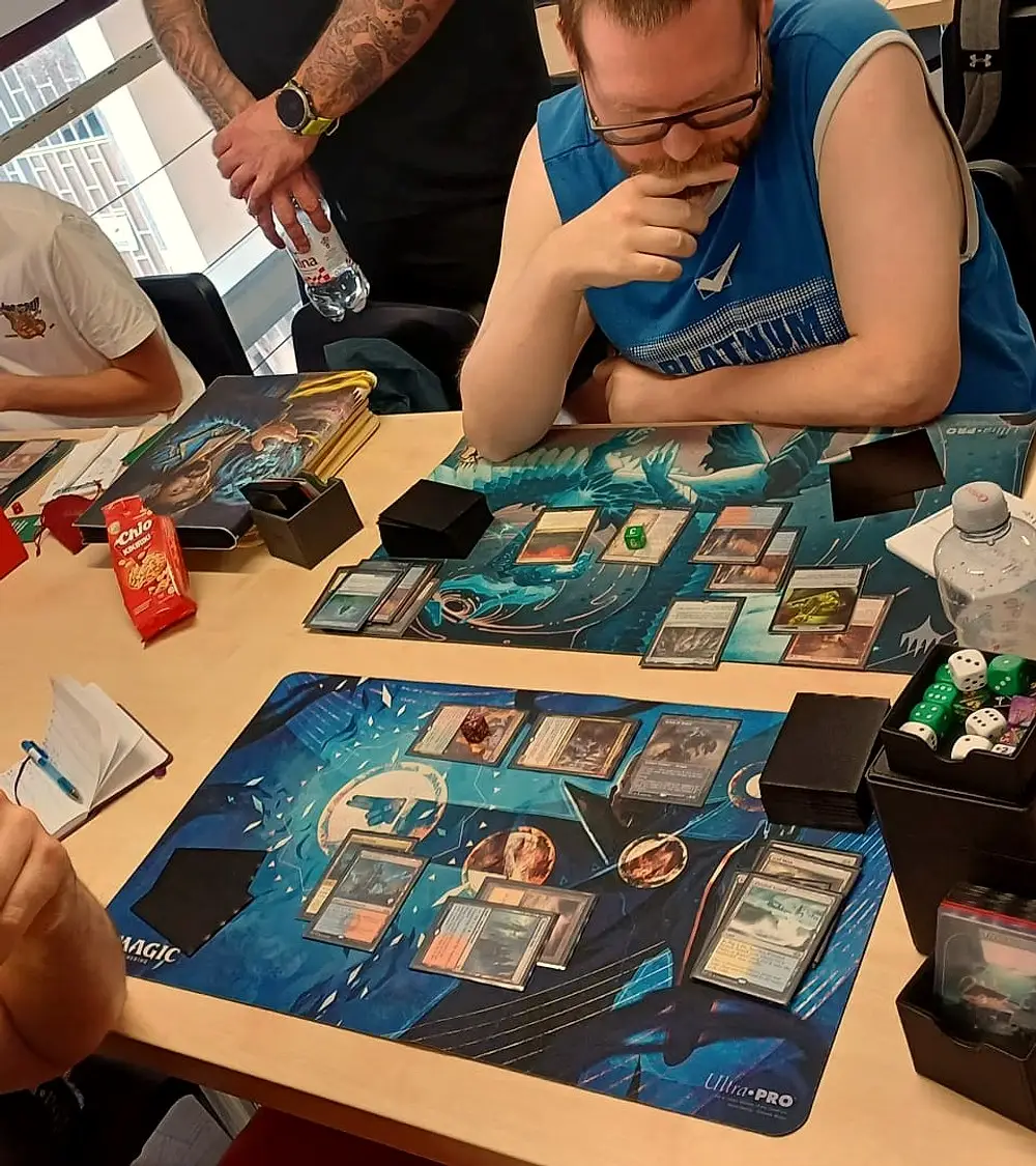 Two players during a Magic: The Gathering game at Card Board Kingdom in Pula.